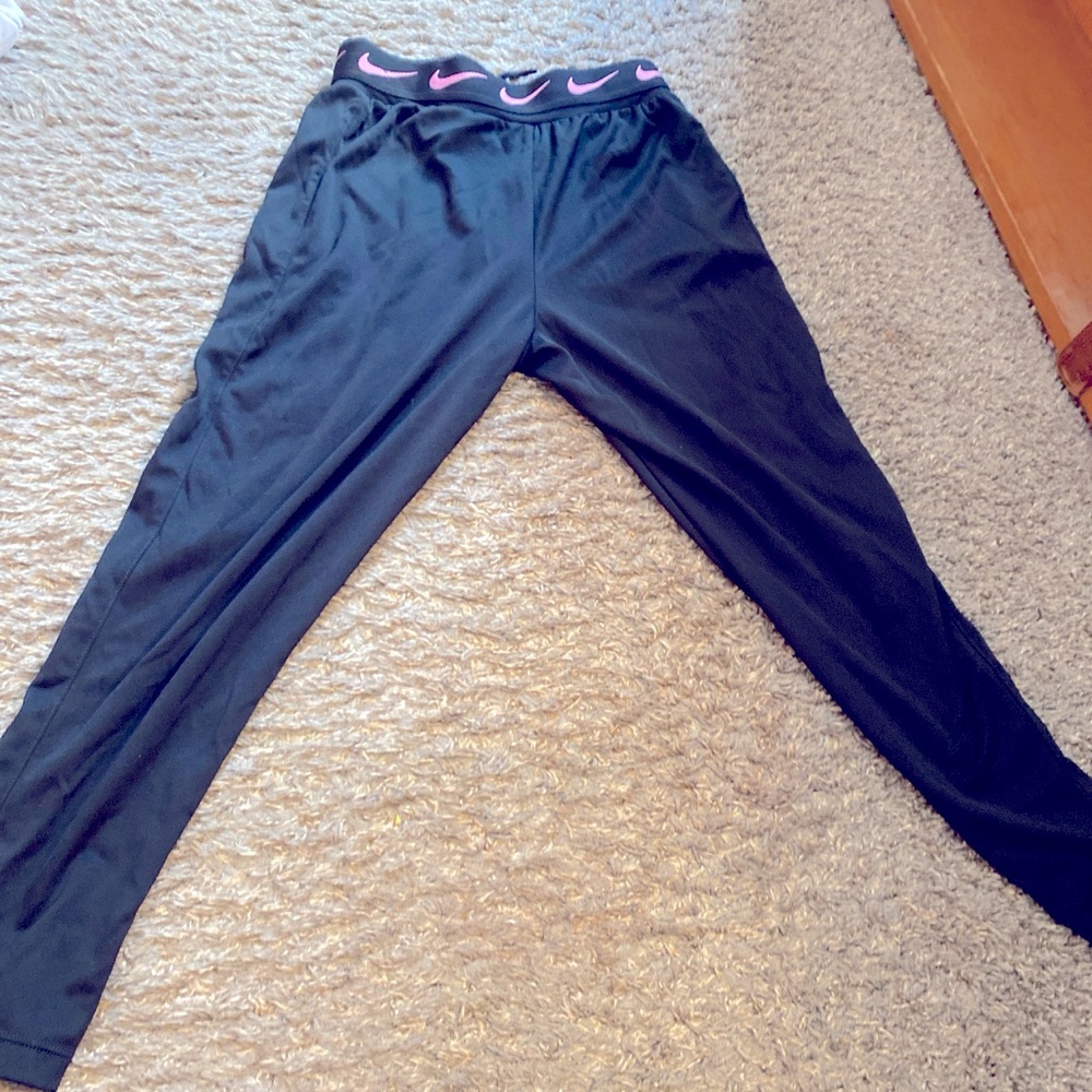 Nike joggers black & pink, Size medium in kids, strings have some defects.
